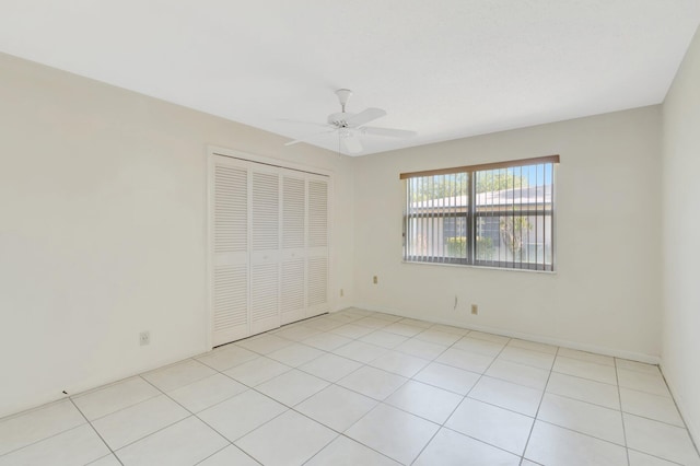955 Circle A Dr Unit A, Delray Beach, FL 33445 - unfurnished bedroom with a closet, ceiling fan, and light tile patterned flooring