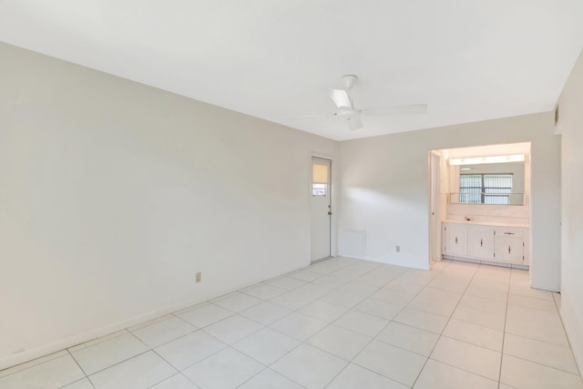 955 Circle A Dr Unit A, Delray Beach, FL 33445 - spare room with a ceiling fan and light tile patterned flooring