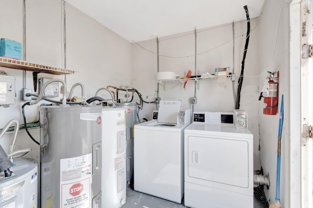 955 Circle A Dr Unit A, Delray Beach, FL 33445 - laundry room with electric water heater, washing machine and dryer, and electric panel