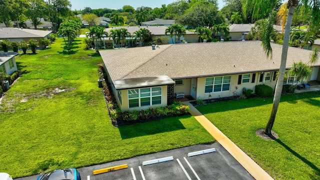955 Circle A Dr Unit A, Delray Beach, FL 33445 - single story home featuring uncovered parking, stucco siding, a front yard, and a residential view