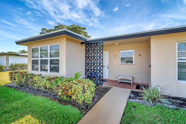 955 Circle A Dr Unit A, Delray Beach, FL 33445 - property entrance with stucco siding