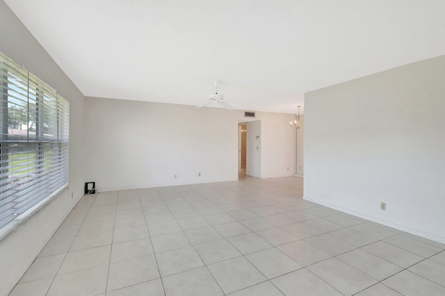 955 Circle A Dr Unit A, Delray Beach, FL 33445 - spare room with a chandelier, a ceiling fan, and light tile patterned floors