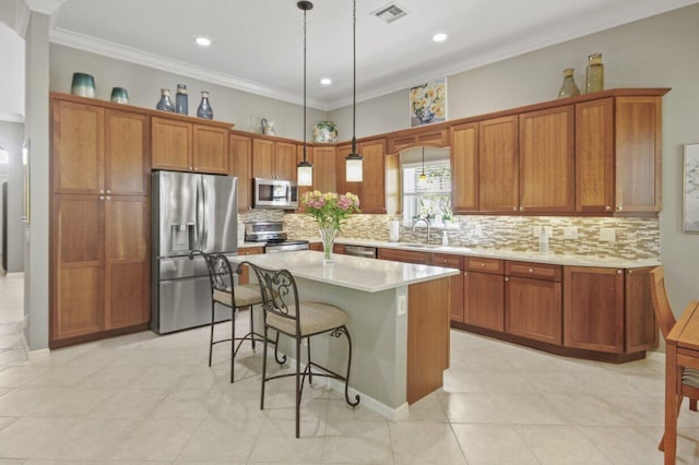 kitchen with stainless steel appliances, visible vents, and brown cabinetry
