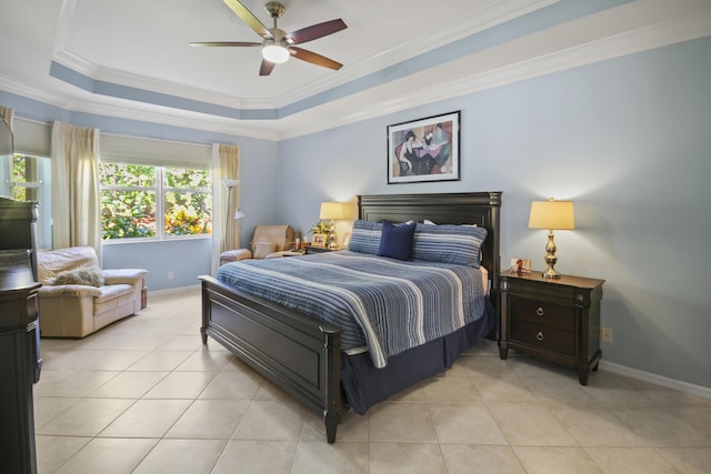 bedroom with baseboards, ornamental molding, light tile patterned floors, and a raised ceiling