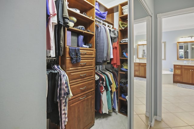 spacious closet featuring light tile patterned floors