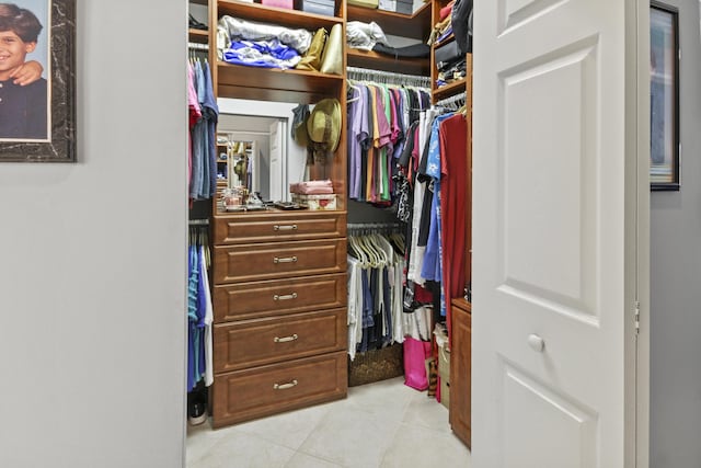 spacious closet featuring light tile patterned floors
