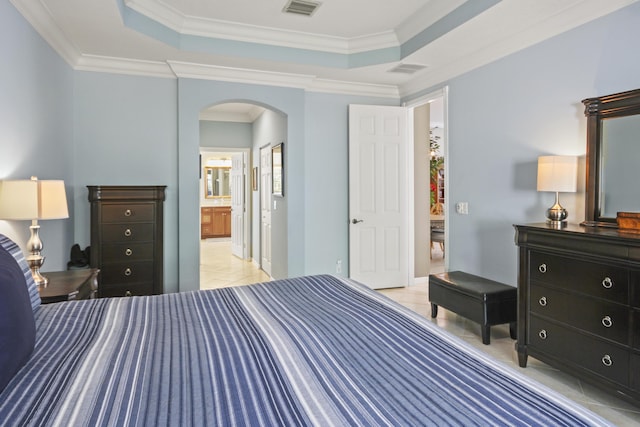 6809 Via Bellini, Lake Worth, FL 33467 - bedroom featuring arched walkways, a raised ceiling, crown molding, and ensuite bathroom