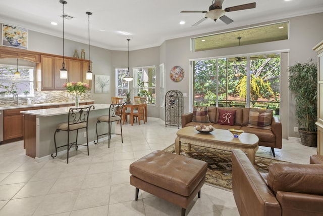 living room featuring recessed lighting, crown molding, ceiling fan, and light tile patterned floors