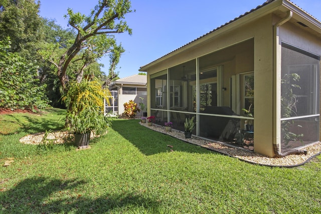view of yard with a sunroom
