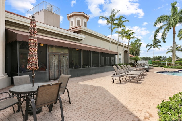 view of patio / terrace featuring a community pool