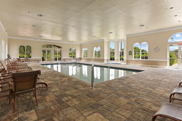 indoor pool featuring french doors