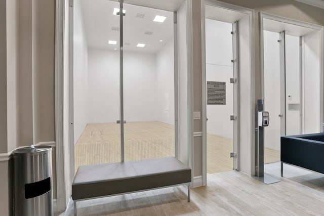 entryway with wood finished floors