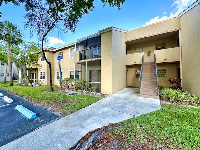 880 Cypress Park Way Unit E, Deerfield Beach, FL 33064 - view of property with uncovered parking and stairs