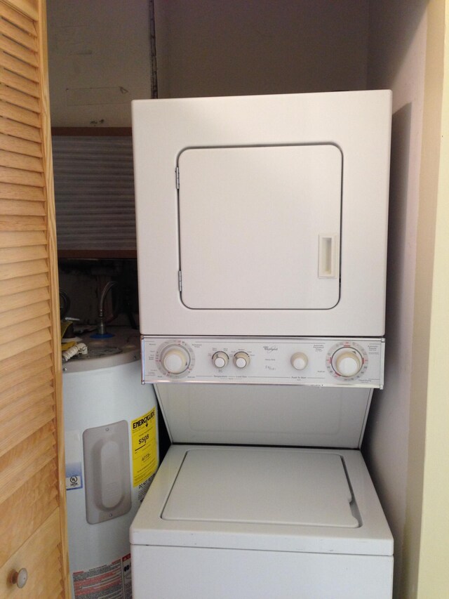 880 Cypress Park Way Unit E, Deerfield Beach, FL 33064 - washroom with water heater, stacked washer / drying machine, and laundry area