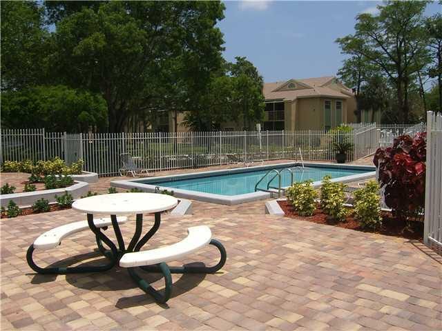 880 Cypress Park Way Unit E, Deerfield Beach, FL 33064 - pool with fence and a patio