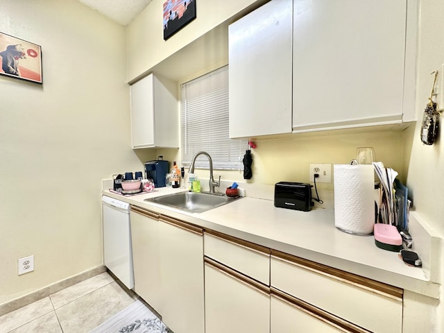 880 Cypress Park Way Unit E, Deerfield Beach, FL 33064 - kitchen with light countertops, dishwasher, a sink, light tile patterned flooring, and white cabinetry