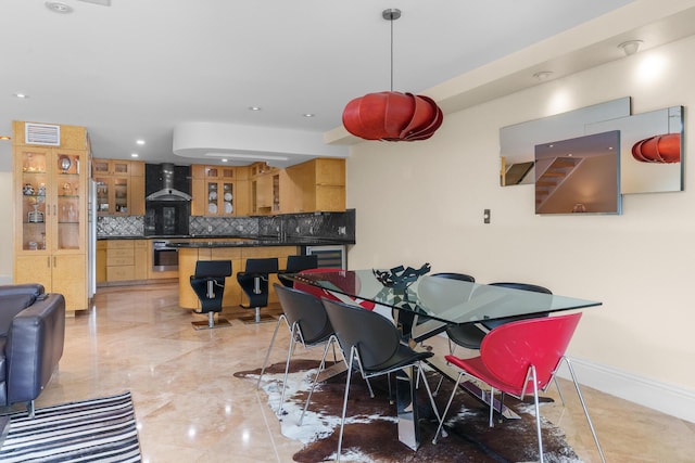 dining room featuring marble finish floor, baseboards, visible vents, and recessed lighting