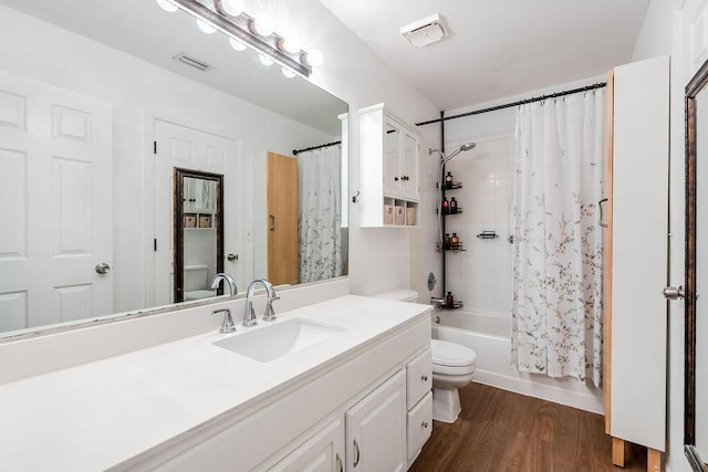 5606 Channel Dr, Lake Worth, FL 33463 - full bathroom with shower / bath combo with shower curtain, wood finished floors, toilet, and vanity