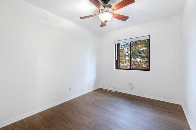 5606 Channel Dr, Lake Worth, FL 33463 - unfurnished room with dark wood-type flooring, a textured ceiling, and baseboards