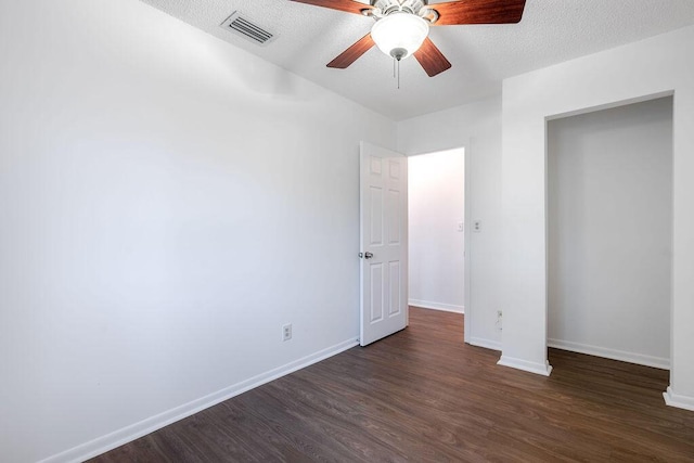 5606 Channel Dr, Lake Worth, FL 33463 - unfurnished bedroom featuring baseboards, visible vents, a textured ceiling, and dark wood-style flooring