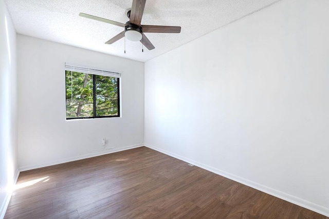5606 Channel Dr, Lake Worth, FL 33463 - empty room with a textured ceiling, a ceiling fan, baseboards, and dark wood finished floors
