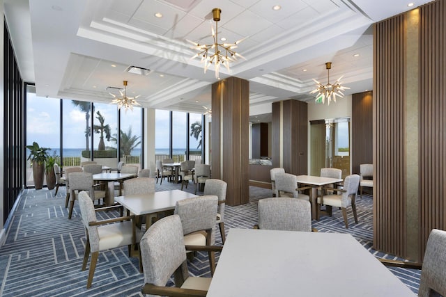 2600 S Ocean Blvd Phd, Phd, Boca Raton, FL 33432 - carpeted dining area featuring a chandelier, a tray ceiling, a wall of windows, healthy amount of natural light, and a water view