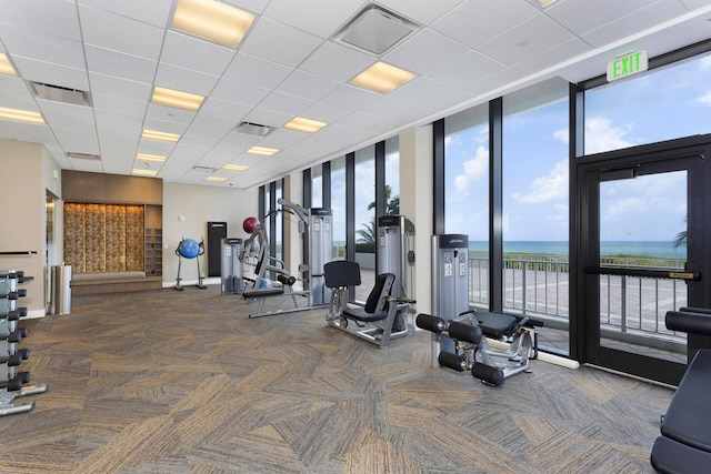 2600 S Ocean Blvd Phd, Phd, Boca Raton, FL 33432 - workout area with carpet, expansive windows, healthy amount of natural light, a water view, and a paneled ceiling