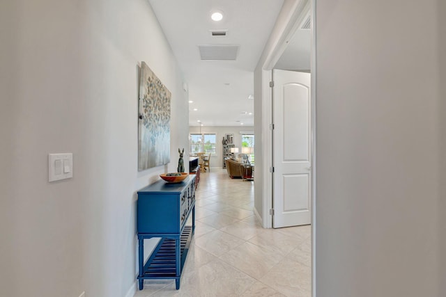 hallway with recessed lighting, baseboards, visible vents, and light tile patterned floors
