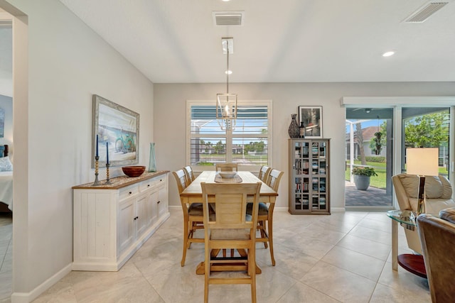 dining area featuring light tile patterned floors, baseboards, and visible vents