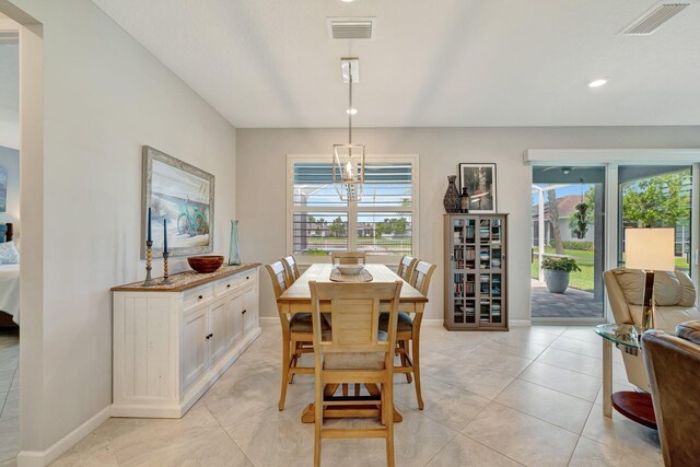 13339 SW Gingerline Dr, Port Saint Lucie, FL 34987 - dining area with baseboards, light tile patterned floors, and recessed lighting