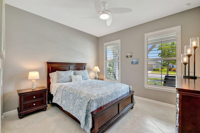 bedroom with baseboards and ceiling fan
