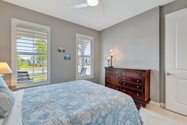 13339 SW Gingerline Dr, Port Saint Lucie, FL 34987 - bedroom featuring a ceiling fan and baseboards