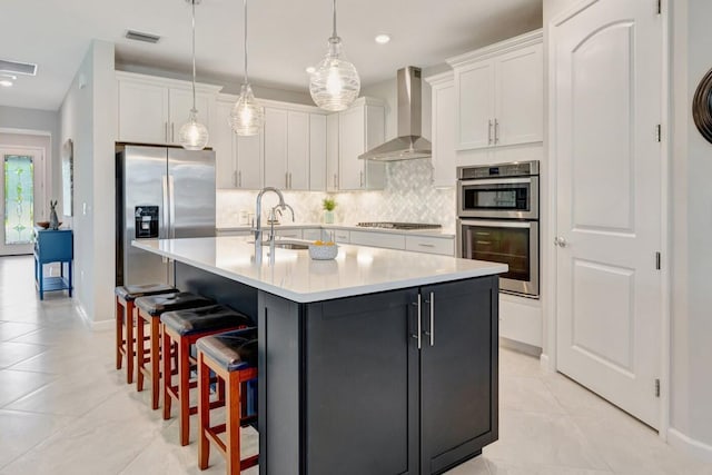 13339 SW Gingerline Dr, Port Saint Lucie, FL 34987 - kitchen with wall chimney exhaust hood, a sink, stainless steel appliances, backsplash, and white cabinets