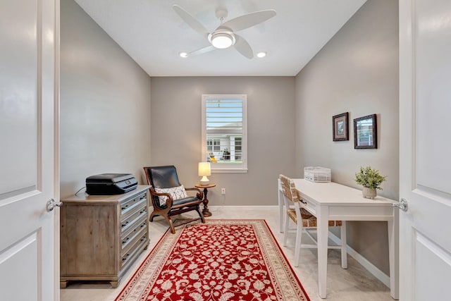 office area with baseboards and a ceiling fan