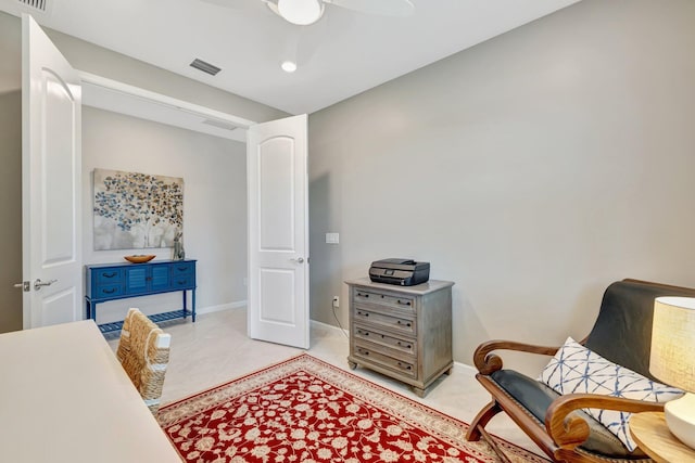 home office with ceiling fan, visible vents, and baseboards
