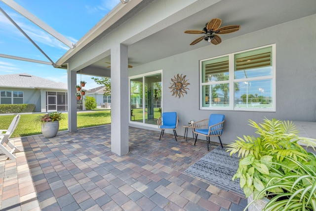 view of patio / terrace with glass enclosure and ceiling fan