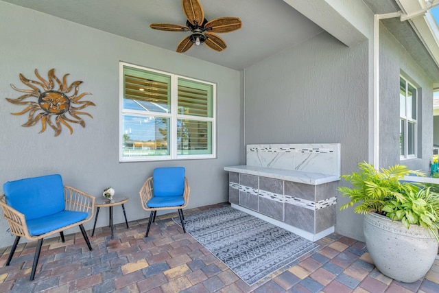 view of patio / terrace featuring a ceiling fan