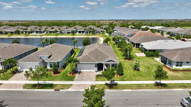 bird's eye view with a water view and a residential view