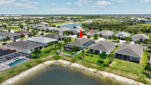 aerial view featuring a residential view and a water view