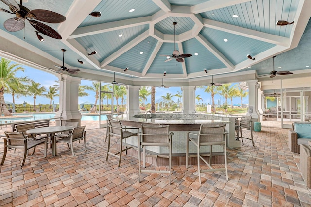 13339 SW Gingerline Dr, Port Saint Lucie, FL 34987 - view of patio / terrace with a ceiling fan, exterior bar, and an outdoor pool