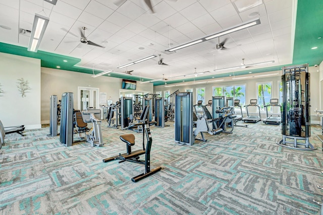 13339 SW Gingerline Dr, Port Saint Lucie, FL 34987 - exercise room featuring a ceiling fan, carpet, and baseboards
