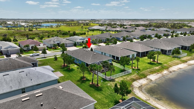bird's eye view with a residential view and a water view