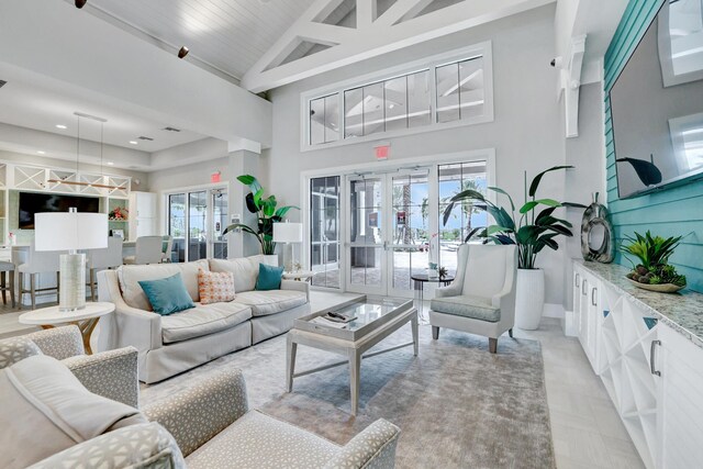 13339 SW Gingerline Dr, Port Saint Lucie, FL 34987 - living room with high vaulted ceiling, french doors, recessed lighting, and baseboards