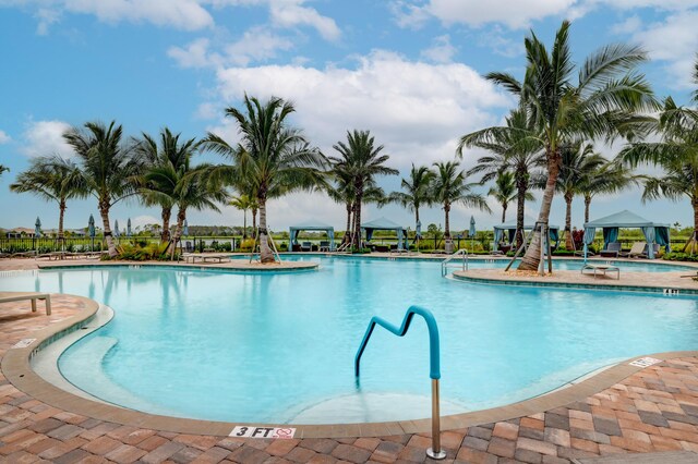 13339 SW Gingerline Dr, Port Saint Lucie, FL 34987 - community pool featuring a gazebo and a patio