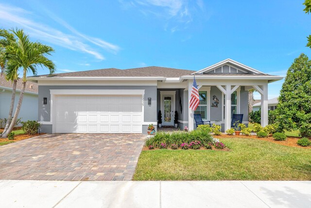 13339 SW Gingerline Dr, Port Saint Lucie, FL 34987 - ranch-style house with stucco siding, driveway, a garage, and a front lawn