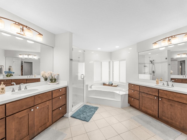8659 Thousand Pines Cir, West Palm Beach, FL 33411 - full bath featuring a shower stall, a garden tub, tile patterned floors, two vanities, and recessed lighting