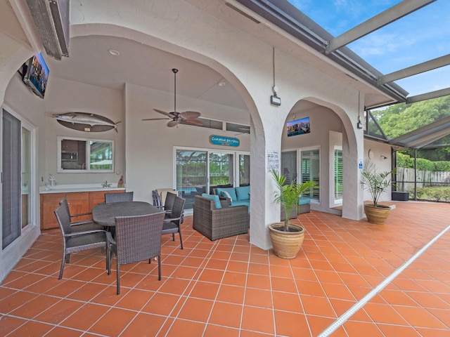 8659 Thousand Pines Cir, West Palm Beach, FL 33411 - view of patio with an outdoor hangout area, glass enclosure, and a ceiling fan