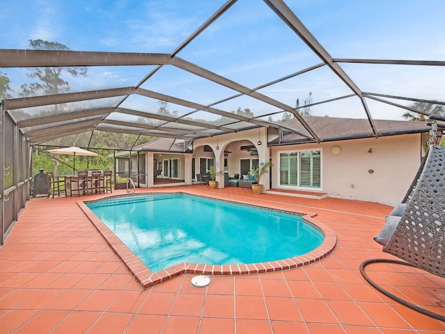 8659 Thousand Pines Cir, West Palm Beach, FL 33411 - outdoor pool with a patio area, glass enclosure, and outdoor lounge area