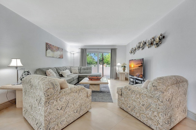 3212 NE 12th St Unit 201, Pompano Beach, FL 33062 - living area with baseboards and light tile patterned flooring