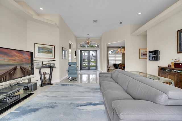 living room featuring a chandelier, baseboards, and recessed lighting